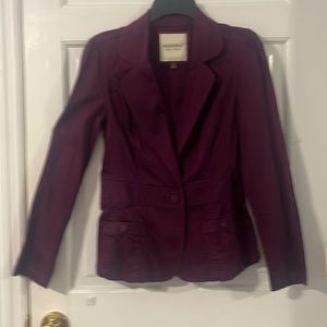 Pretty deep purple blazer. Woman’s size small. 98% cotton & 2% spandex.